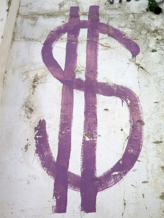 Purple rendering of Dollar sign on wallの写真素材