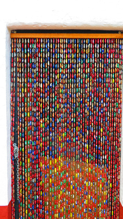 Alora, Spain 23 April 2016: Close-up of colourful Bottle top curtainのeditorial素材