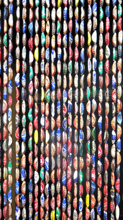 Alora, Spain 23 April 2016: Close-up of colourful Bottle top curtainのeditorial素材