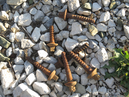 Discarded railway sleeper fastening bolts next to railway line, Alora, Andaluciaの写真素材