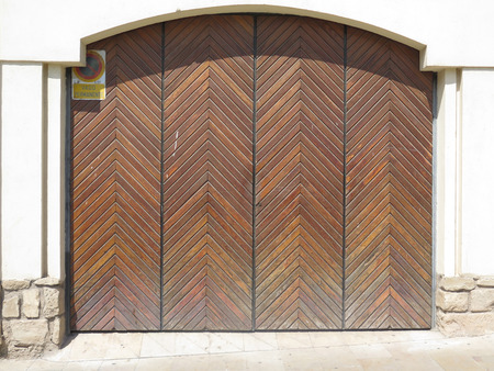 Varnished Ornate carved Garage Door in Jaen, Spain