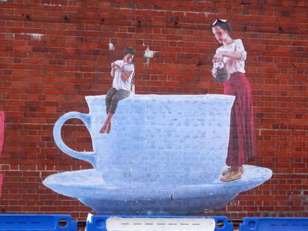 London, England - October 6, 2016: Decorations on brick wall in London East Endのeditorial素材