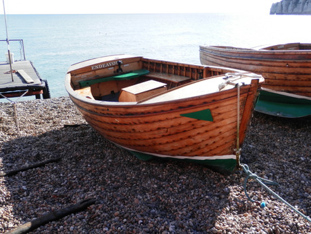 Beer, United Kingdom - October 10, 2016: Rowing boat on the beach at Beer Village, East Devon.のeditorial素材