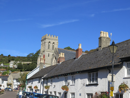 Parish church and Main Street in Beer Village centre Devon England UK GB EU Europeのeditorial素材