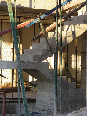 Concrete staircase inside new building being constructed
