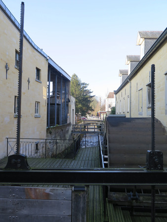 Old wooden watermill wheel on river in Valkenburg, Holland