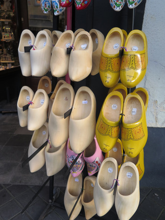 Raw and painted Wooden Dutch Cloggs for saleのeditorial素材