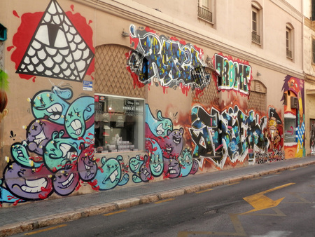 Malaga, Spain - August 27 2016: Overdone Street art around shop windowのeditorial素材