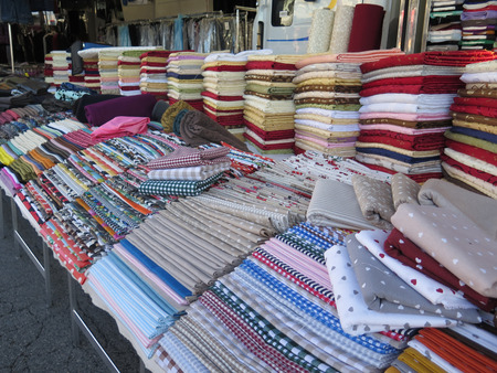 Large display of cloth on market stall in Gaeta in Italy