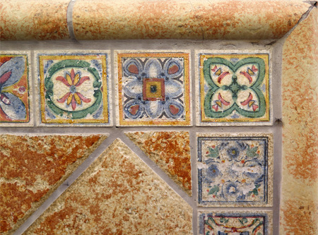 Closeup of Wall tiled with colorful ceramic tiles in village in Andalusiaの写真素材