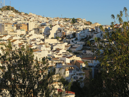 White buildings crowding hillside in Andalusian villageの写真素材