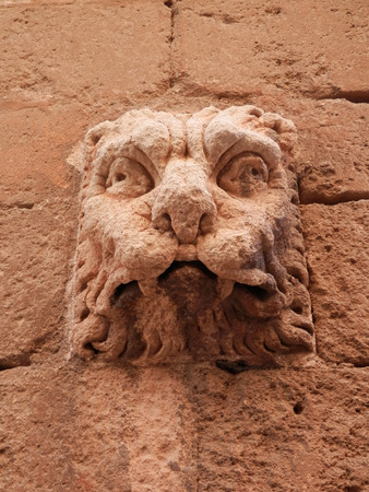 Decorative face on wall of Almeria cathedral, Spainの写真素材
