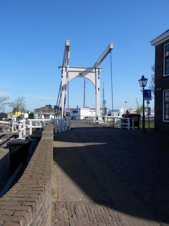 Stavoren, Holland - April 23, 2018: Lift bridge over canal in Dutch fishing villageのeditorial素材
