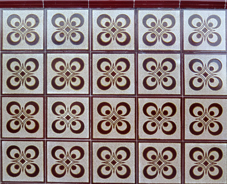 Brown and white ceramic tiles on wall in village in Andalusia