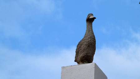 Decorative concrete goose on first floor pillar of Andalusian village houseの写真素材