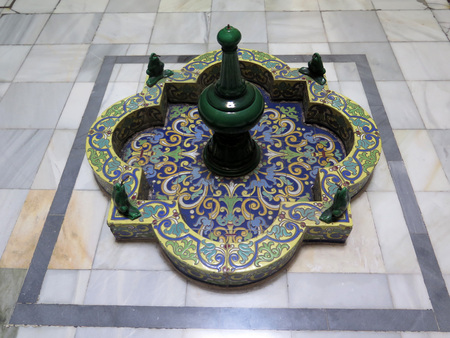 Dry decorative fountain in arabic style decorating entrance hall in old Malaga buildingの写真素材