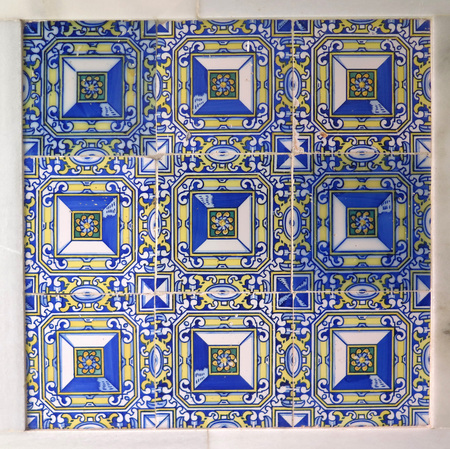 Colorful ceramic tiled wall finish in village in Andalusia