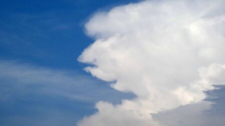 Large white cloud in shape of human face over Andalusian valleyの写真素材