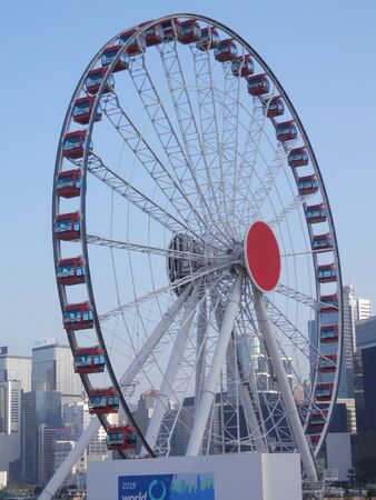 Large ferris wheel on Hong Kong business district waterfrontの写真素材