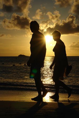    couple by a tropical sun set                            の写真素材