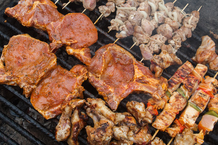 barbecue meat and vegetables on stick grilledの写真素材