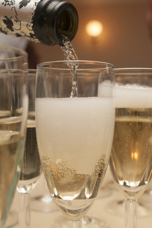 pouring champagne in glassの写真素材