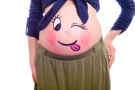 Portrait of young pregnant woman with body art isolated on whiteの写真素材