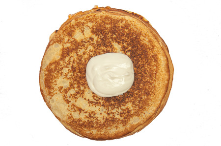 Pancakes and sour cream isolated at white background, top viewの写真素材