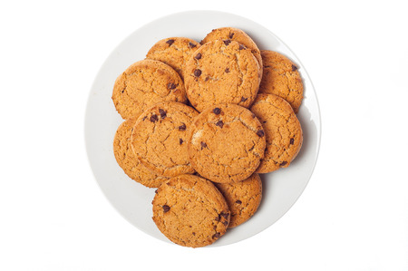 Oat cookies in plate isolated on white background, top viewの写真素材
