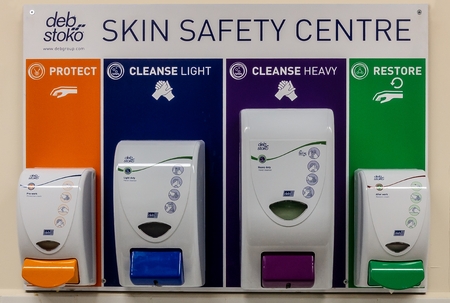 Deb Stoko Skin Safety Centre cream dispensers on a wall in a works welfare unit for occupational...