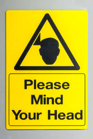 Please mind your head warning signの写真素材