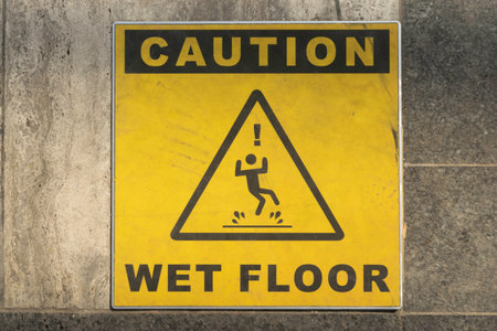 Caution Wet Floor sign on a tiled floorの写真素材