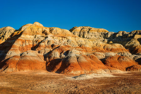 Trekking in The Wucai City Scenic Area near Urumqi, Xinjiang, has a magnificent and dazzling view of the Danxia landform.の写真素材