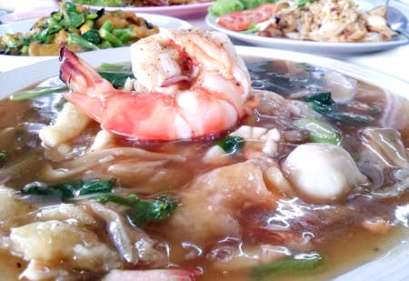 Thai style seafood fried noodle with a big prawnの写真素材