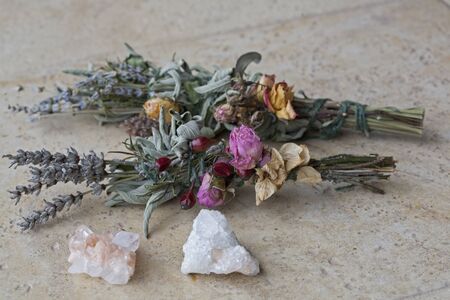 Sage & Lavender Smudge Stick with Dried Flowers, Pink and White Crystalsの写真素材