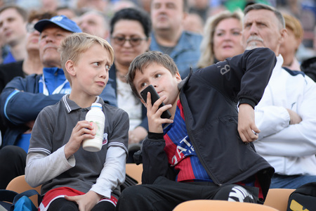 MINSK, BELARUS - MAY 23, 2018: Little fans react during the Belarusian Premier League football match between FC Dynamo Minsk and FC Bate at the Tractor stadium.のeditorial素材