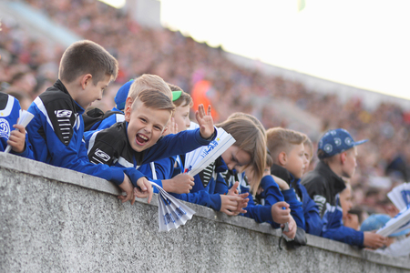 MINSK, BELARUS - MAY 23, 2018: Little fans react during the Belarusian Premier League football match between FC Dynamo Minsk and FC Bate at the Tractor stadium.のeditorial素材