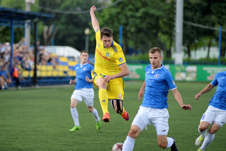 MINSK, BELARUS - JUNE 29, 2018: Soccer players fights for ball during the Belarusian Premier League football match between FC Luch and FC BATE at the Olimpiyskiy stadium.のeditorial素材