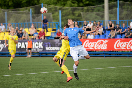 MINSK, BELARUS - JUNE 29, 2018: Soccer players fights for ball during the Belarusian Premier League football match between FC Luch and FC BATE at the Olimpiyskiy stadium.のeditorial素材