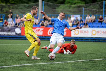 MINSK, BELARUS - JUNE 29, 2018: soccer player scores a goal during the Belarusian Premier League football match between FC Luch and FC BATE at the Olimpiyskiy stadium.のeditorial素材