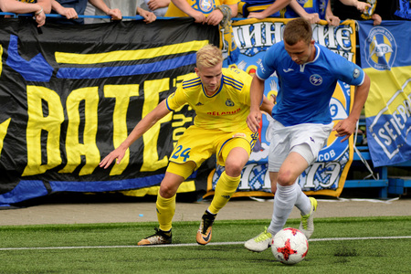 MINSK, BELARUS - JUNE 29, 2018: Soccer players fights for ball during the Belarusian Premier League football match between FC Luch and FC BATE at the Olimpiyskiy stadium.のeditorial素材