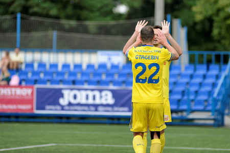 MINSK, BELARUS - JUNE 29, 2018: Soccer players celebrate goal during the Belarusian Premier League football match between FC Luch and FC BATE at the Olimpiyskiy stadium.のeditorial素材