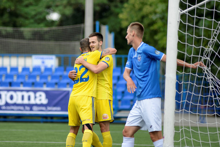 MINSK, BELARUS - JUNE 29, 2018: Soccer players celebrate goal during the Belarusian Premier League football match between FC Luch and FC BATE at the Olimpiyskiy stadium.のeditorial素材
