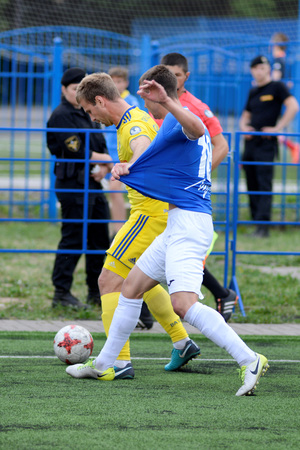 MINSK, BELARUS - JUNE 29, 2018: Soccer players fights for ball during the Belarusian Premier League football match between FC Luch and FC BATE at the Olimpiyskiy stadium.のeditorial素材