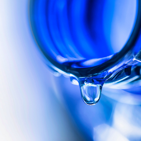 Harmful food additive, flavor, concentrate, flavor stabilizer. Last droplet on the neck of the...
