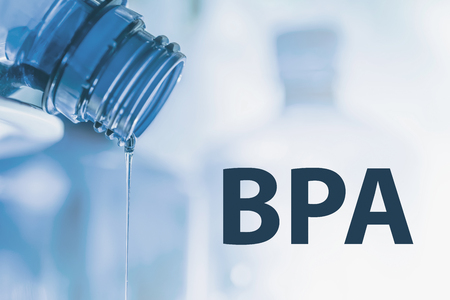 Plastic bottle and liquid stream. Bisphenol, BPA FREE plastic photo.