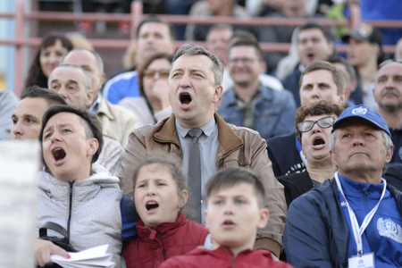 MINSK, BELARUS - MAY 23, 2018: Fans looks game during the Belarusian Premier League football match between FC Dynamo Minsk and FC Bate at the Tractor stadium.のeditorial素材