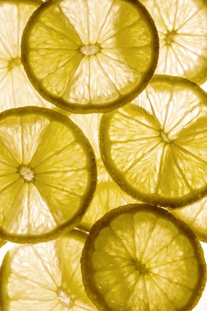 Light background with citrus fruit of lemon slices, backgroundの写真素材