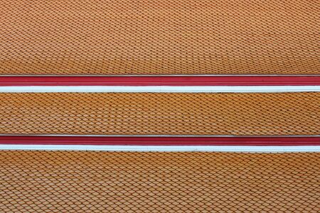 Brown tiles for roofing of the Thai temple as a background