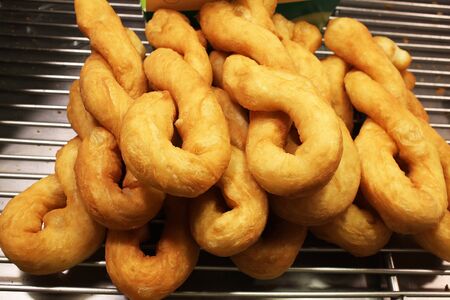 Just finished fried chinese twist donut at a night market in Bangkok, Thailand
